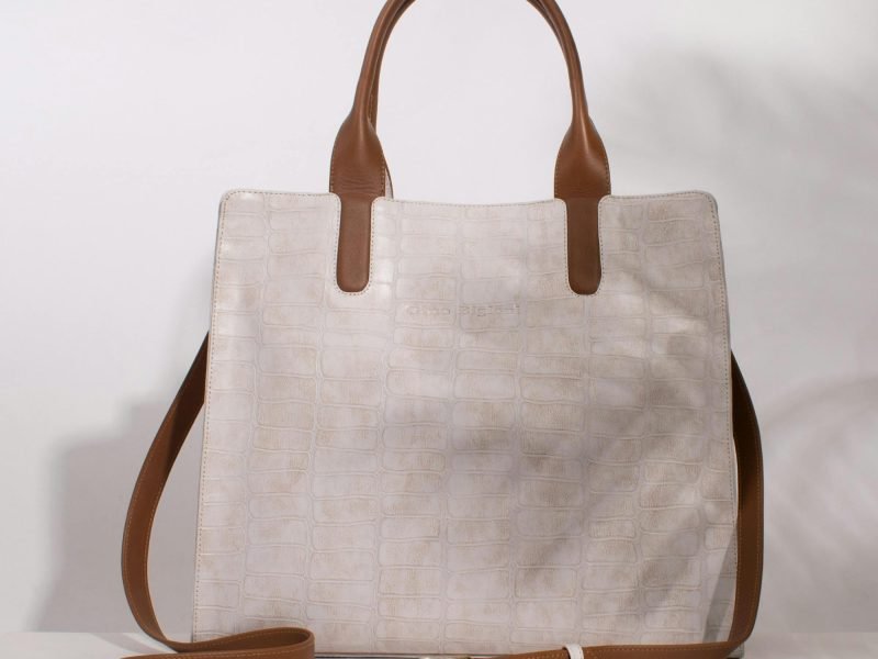 Luxury crocodile pattern handbag in studio shoot showcasing elegance and fashion.