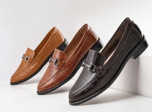 Three pair of elegant leather moccasins in brown tones showcased on a white background.
